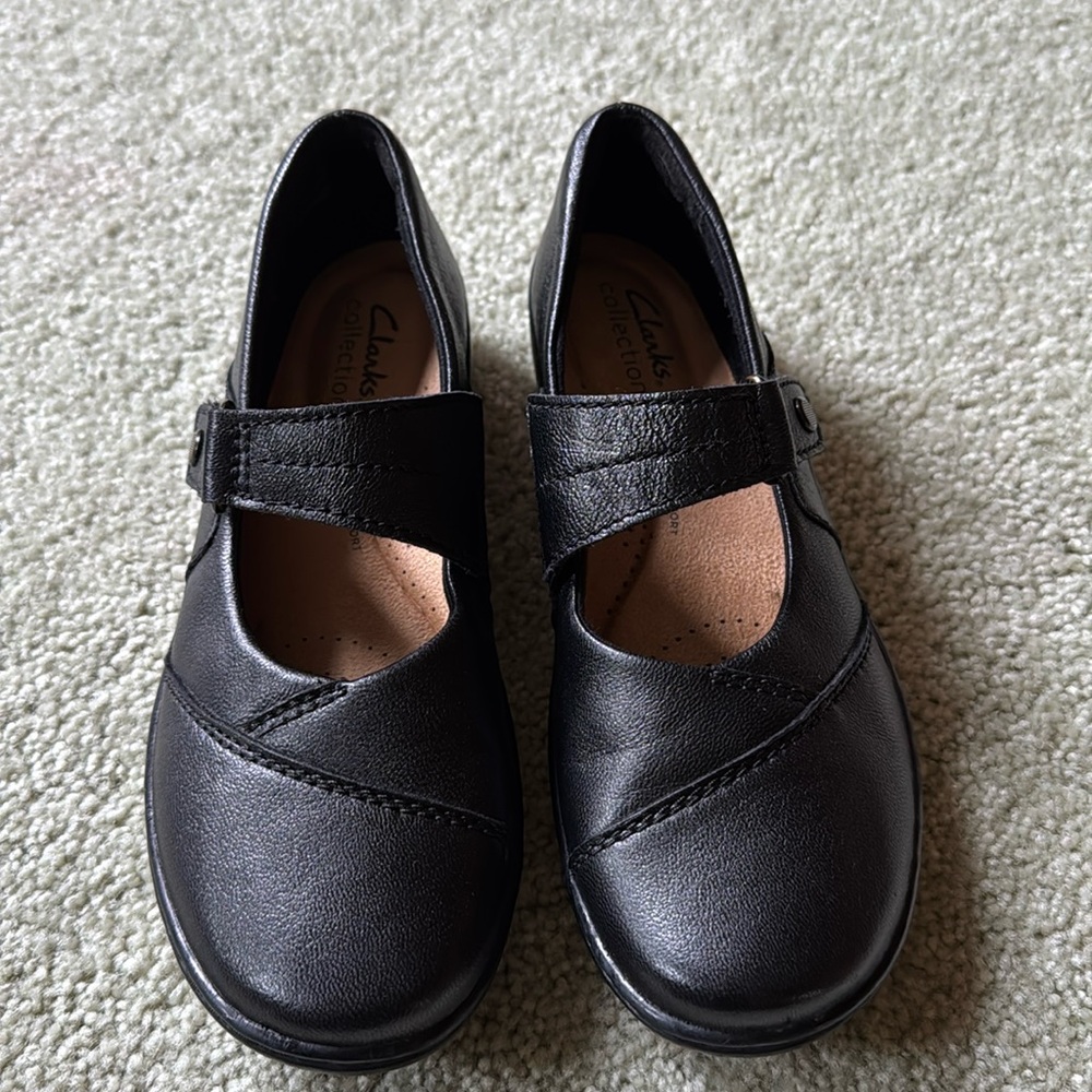 Clark’s black leather shoes. Size 6.